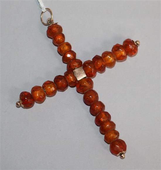 An antique amber and gold cross pendant, 3.75in.